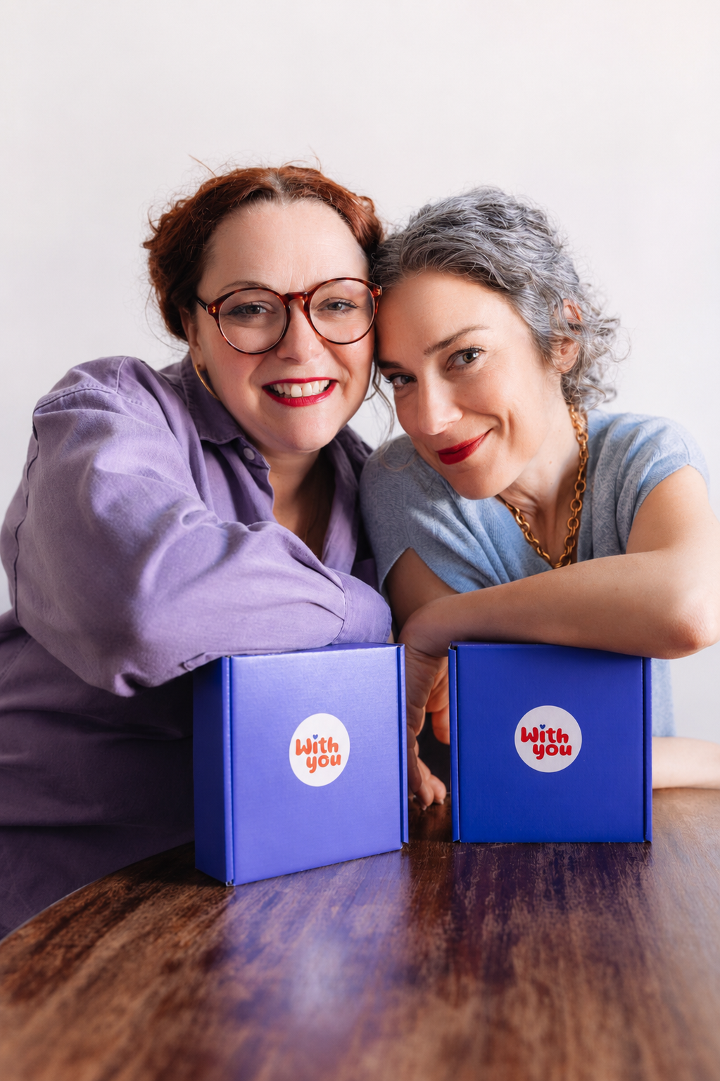 WITH YOU Toycessories® Ltd co-founders Valeria and Dorothea with their branded gift boxes